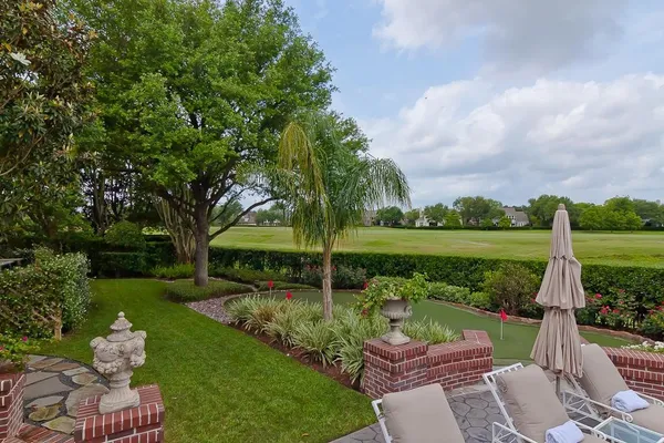 a view of a backyard with sitting area and furniture