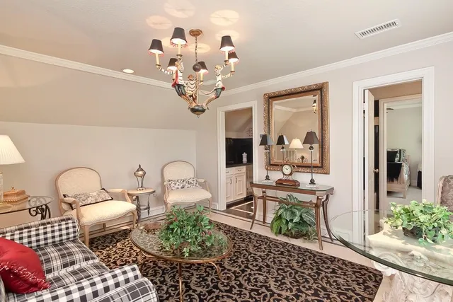 a living room with furniture and windows