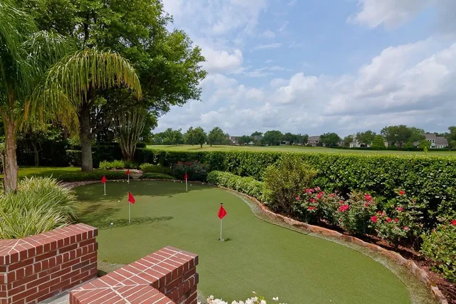 a view of a backyard with sitting area and furniture
