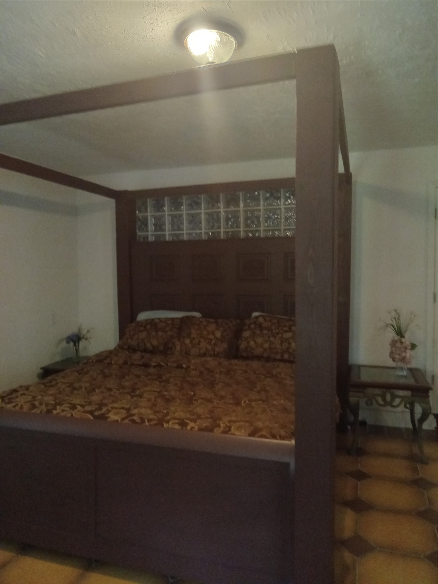 15910 Hartman Road Magnolia, TX 77355 - Photo 11 of 14 a bedroom with a bed and wooden floor