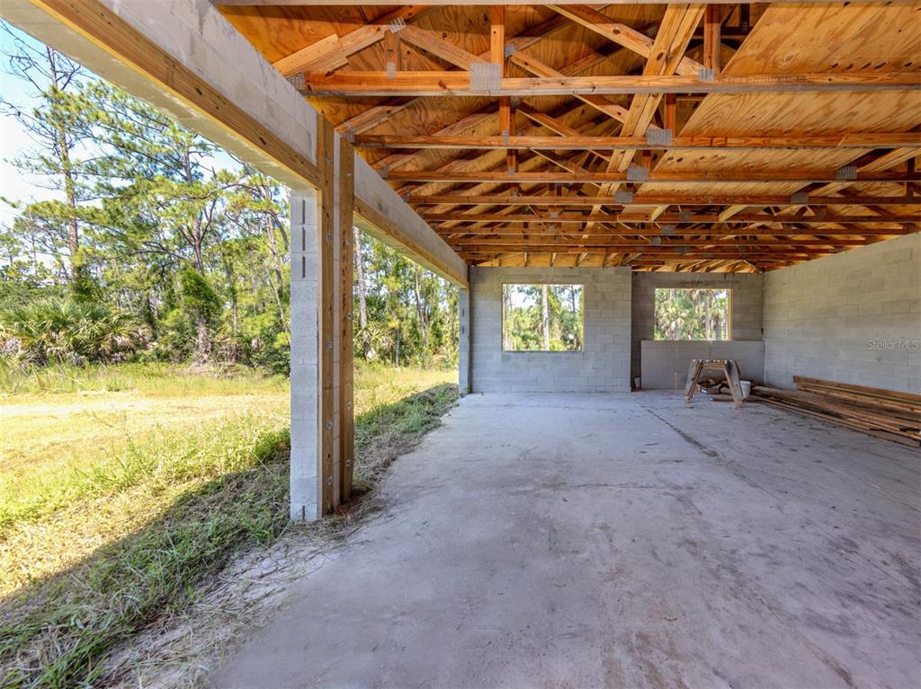 5236 Cromey Road North Port, FL 34288 - Photo 17 of 31 a view of a room with wooden walls and iron stairs
