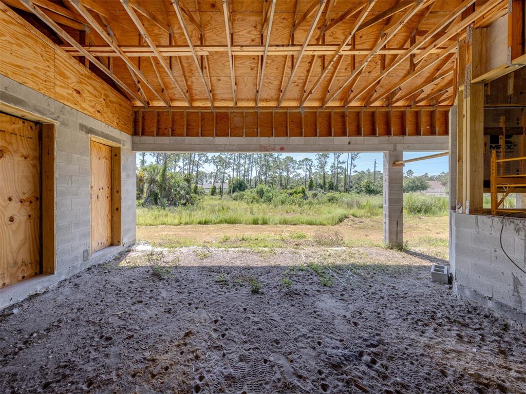 5236 Cromey Road North Port, FL 34288 - Photo 20 of 31 a view of a backyard with large trees and plants