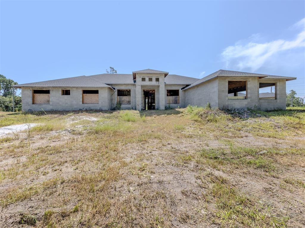 5236 Cromey Road North Port, FL 34288 - Photo 3 of 31 a front view of a house with yard