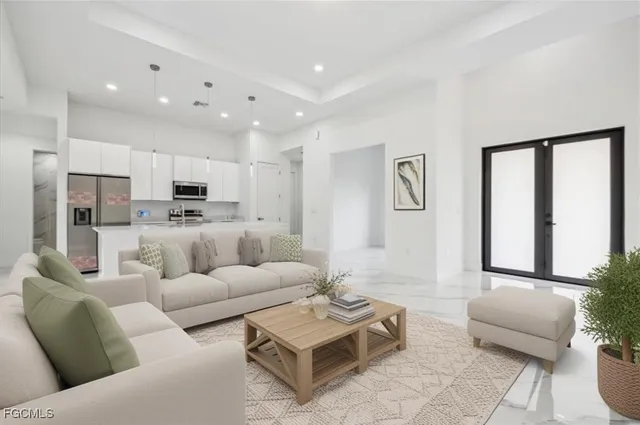 a living room with furniture kitchen and a table