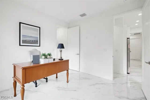 a view of a workspace with furniture