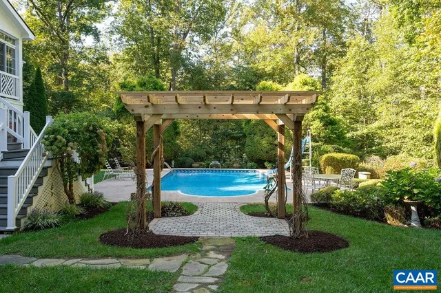 a view of barbeque grill with tub and yard