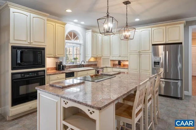 a kitchen with a sink cabinets and wooden floor