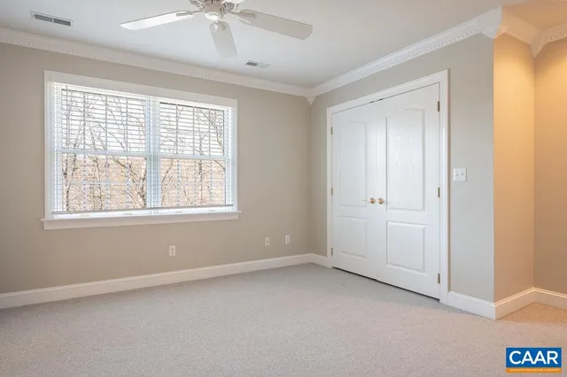 a view of an empty room and a window
