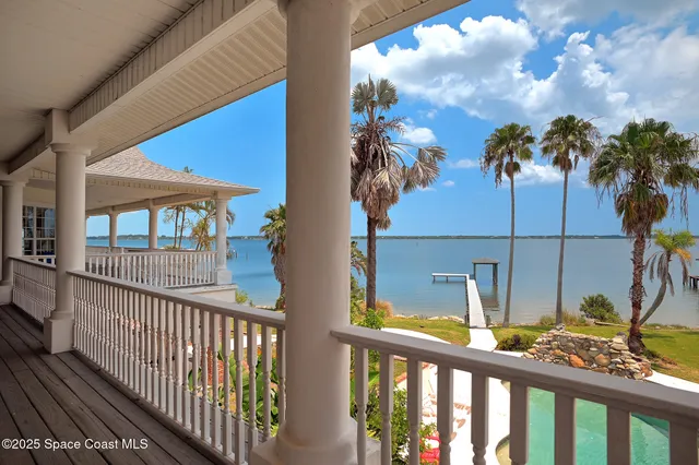 a view of a swimming pool with a table and chairs