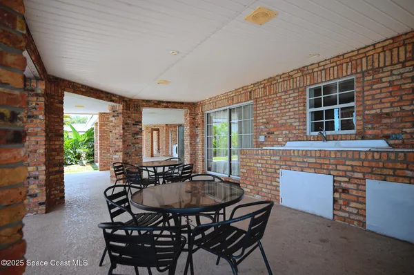 a view of a garden with an outdoor seating