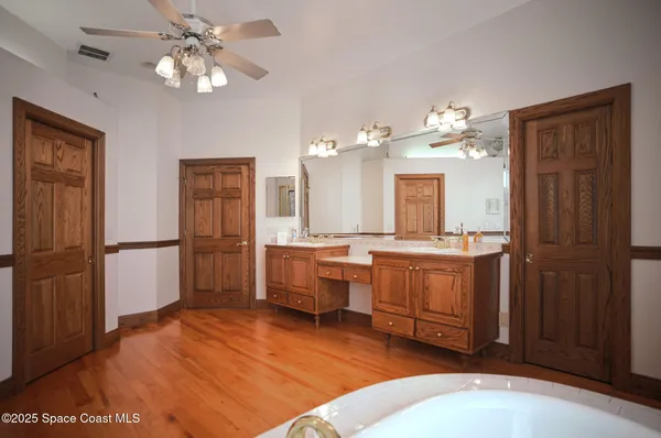 a bedroom with a bed and a table