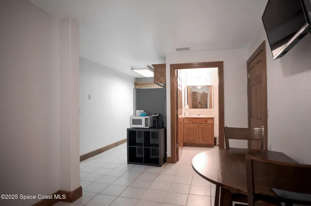 a kitchen with stainless steel appliances granite countertop a stove refrigerator sink and cabinets