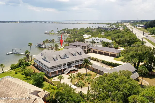 a view of a lake with boats and trees in the background