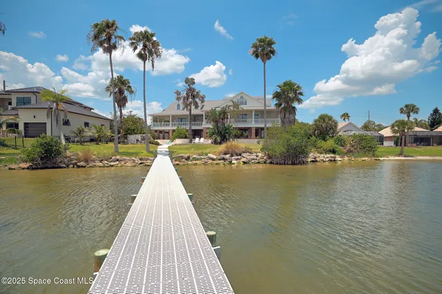 a house view with swimming pool in front of it