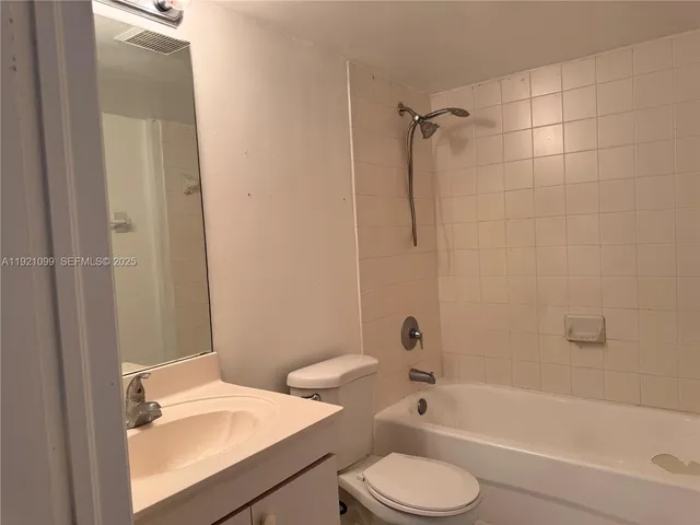 a bathroom with a sink a toilet and a bathtub