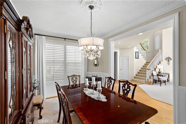 a view of a dining room with furniture and window