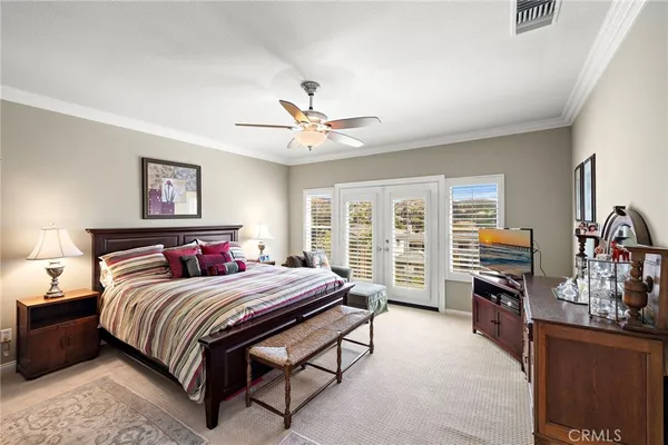 a bedroom with a bed dresser and a window