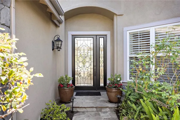 a view of a entryway door front of a house