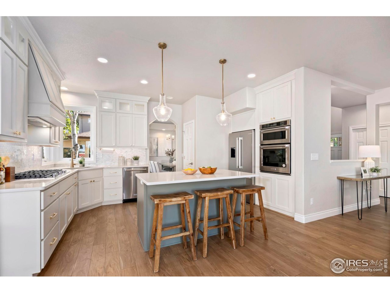 5256 Augusta Trail Fort Collins, CO 80528 - Photo 12 of 50 a large kitchen with a table and chairs