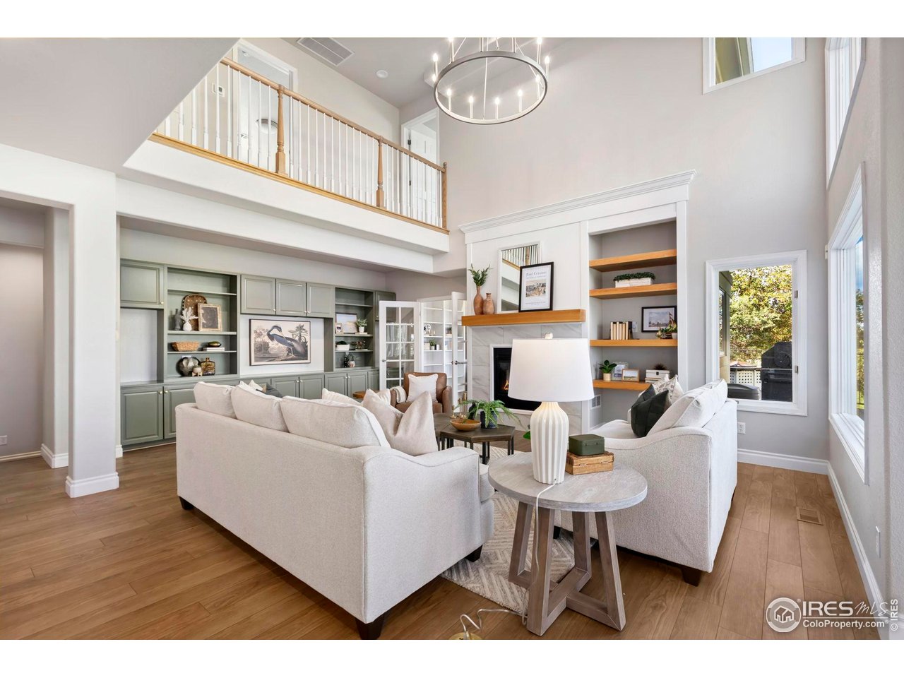 5256 Augusta Trail Fort Collins, CO 80528 - Photo 17 of 50 a living room with fireplace furniture and a wooden floor