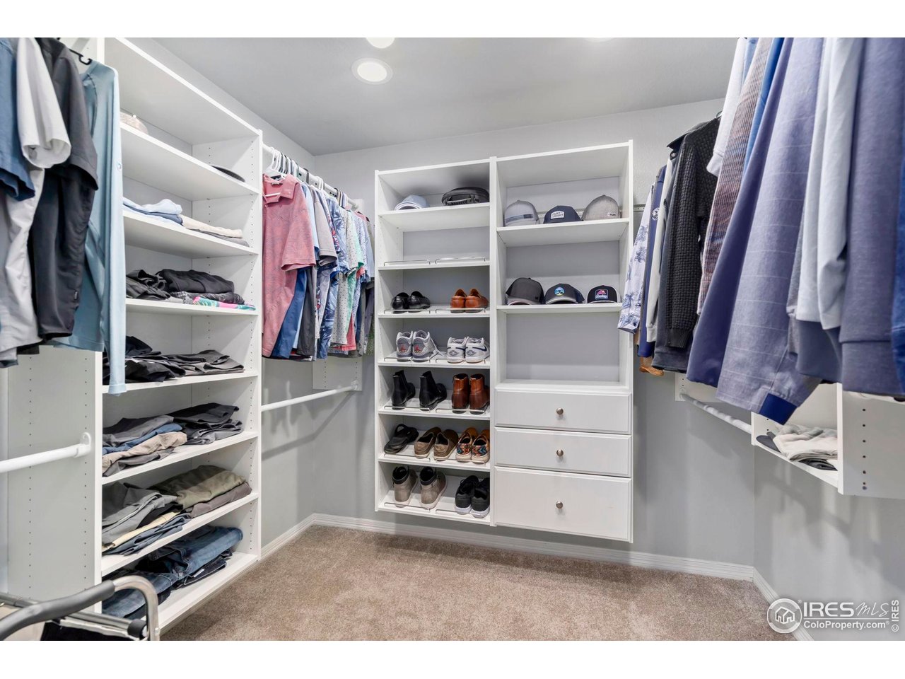 5256 Augusta Trail Fort Collins, CO 80528 - Photo 32 of 50 a view of walk in closet with clothes and shoes