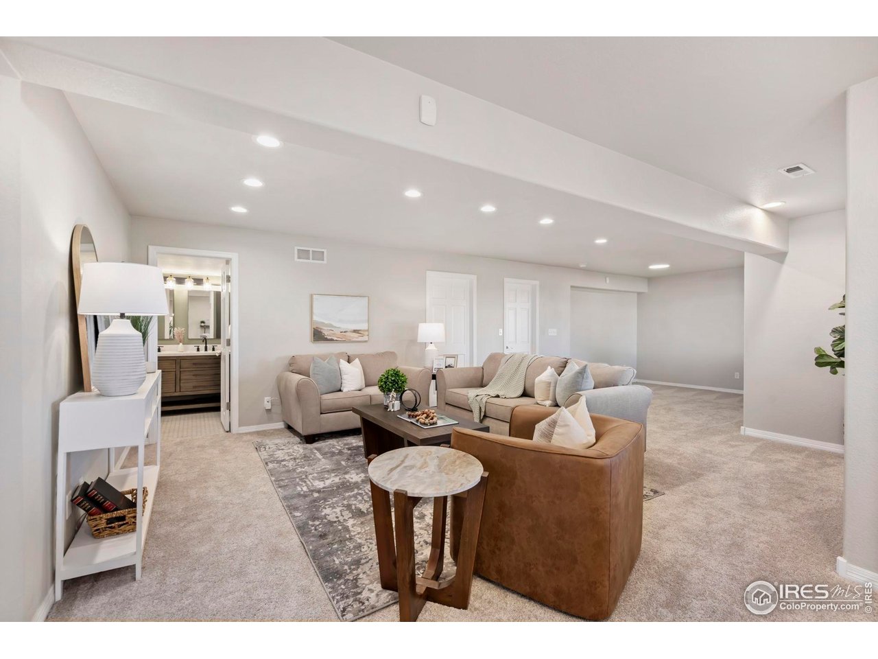 5256 Augusta Trail Fort Collins, CO 80528 - Photo 38 of 50 a living room with furniture and a table
