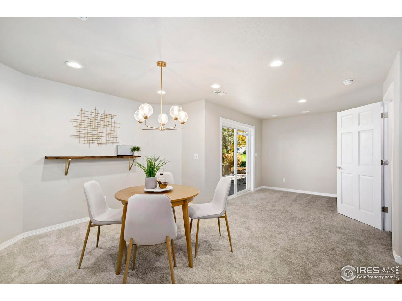 5256 Augusta Trail Fort Collins, CO 80528 - Photo 39 of 50 a view of a dining room with furniture and a chandelier
