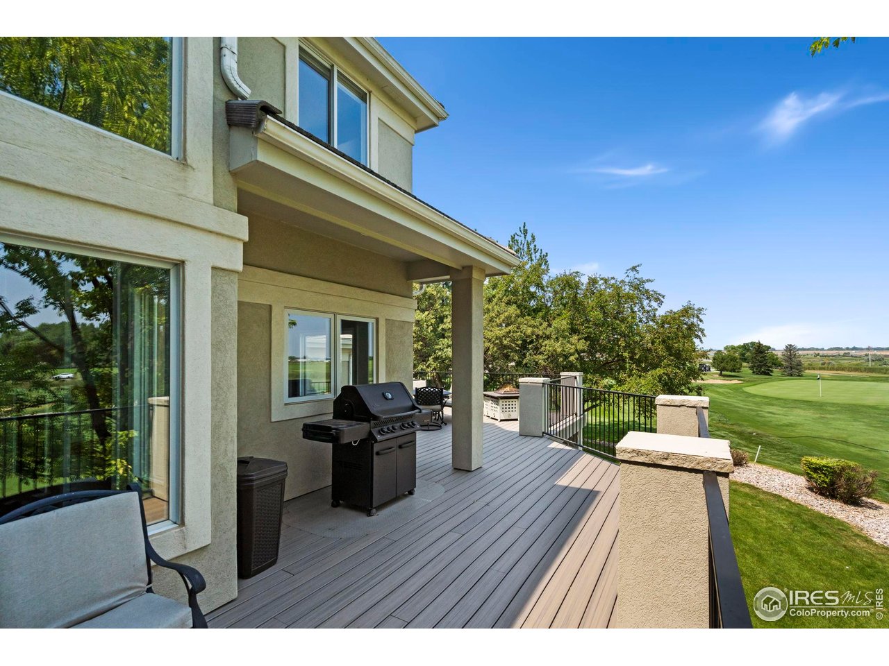 5256 Augusta Trail Fort Collins, CO 80528 - Photo 45 of 50 a view of a house with lounge chairs in a patio