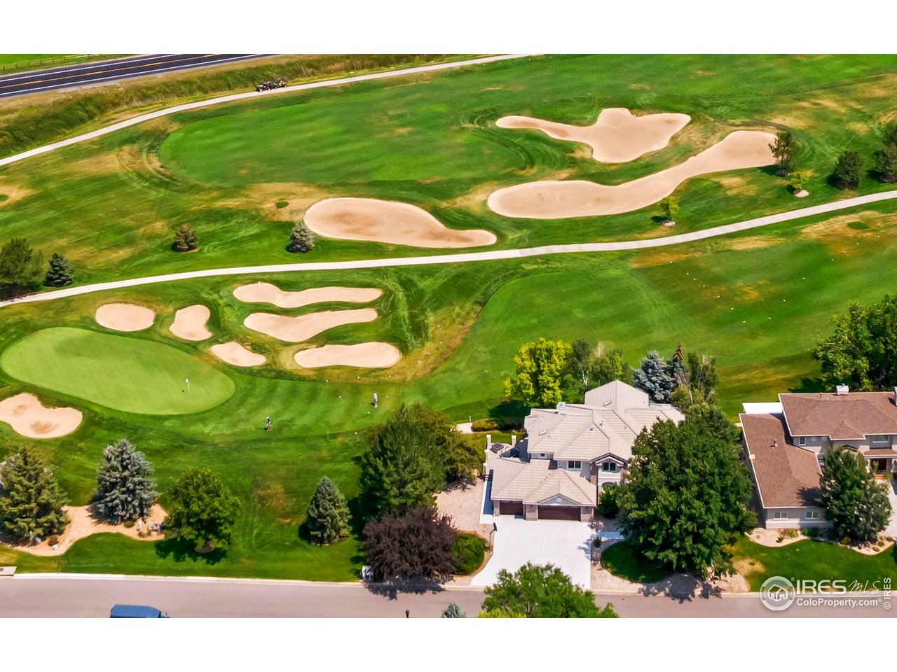 5256 Augusta Trail Fort Collins, CO 80528 - Photo 50 of 50 a view of a golf course with a lake