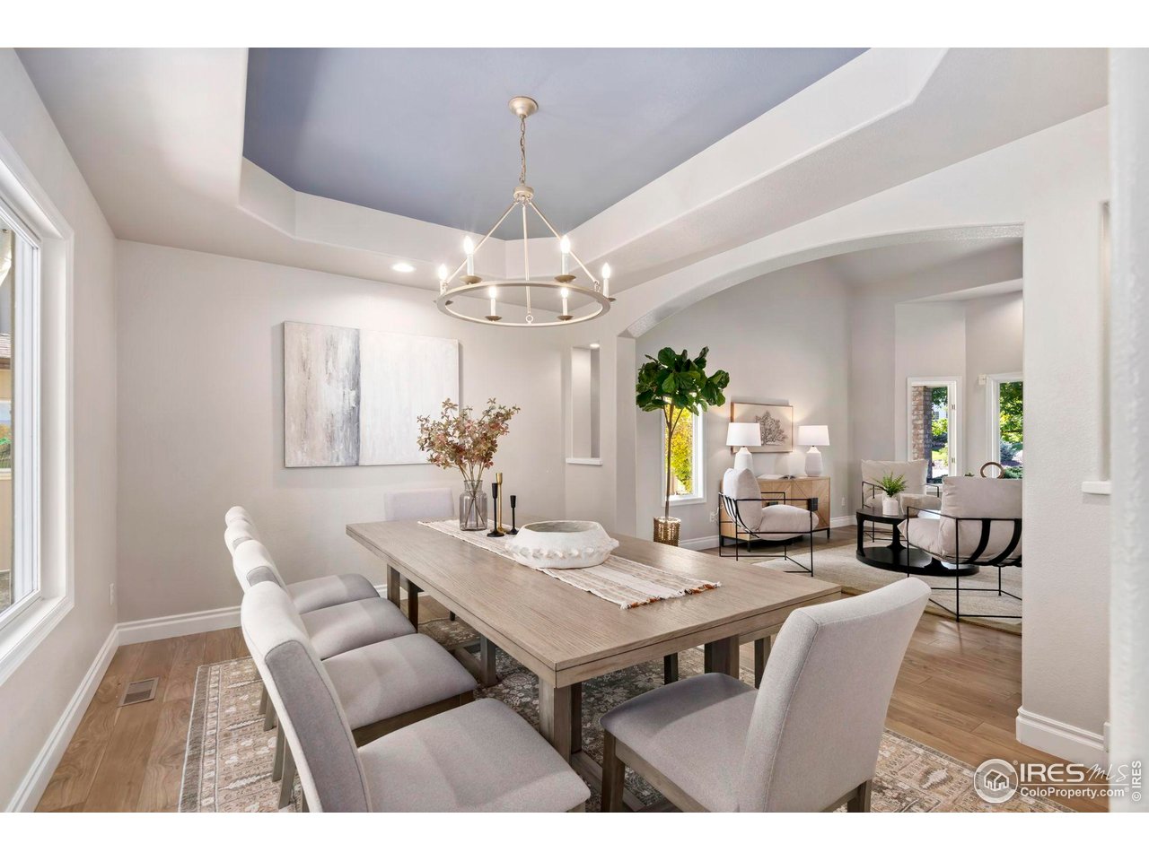 5256 Augusta Trail Fort Collins, CO 80528 - Photo 10 of 50 a living room with dining table and a chandelier