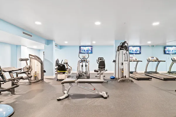 a view of a patio with a table chairs and a garden