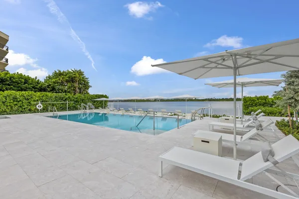 a view of swimming pool with an outdoor seating
