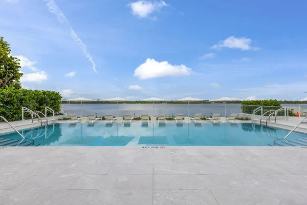 a view of swimming pool with outdoor space and seating area