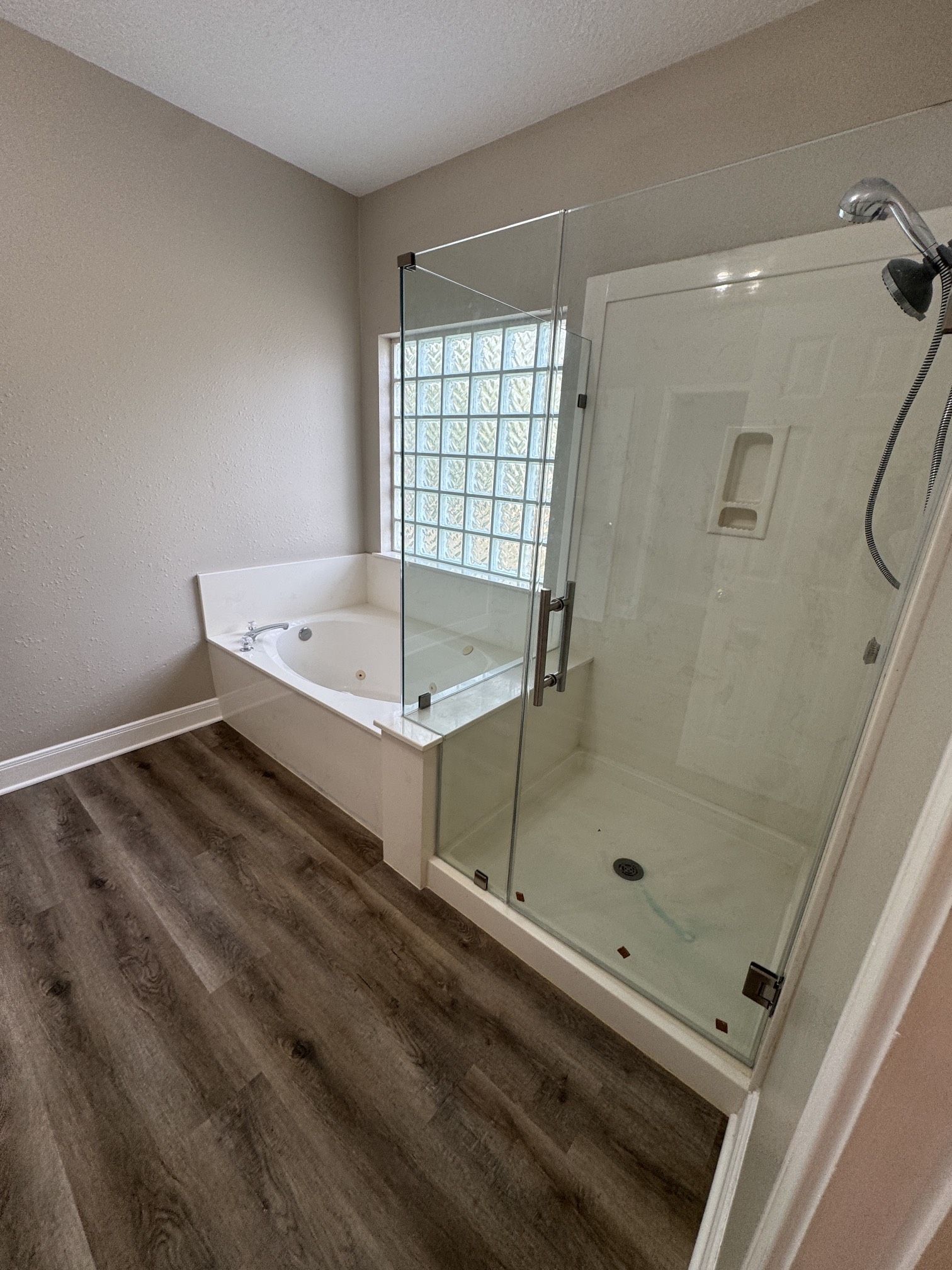 201 Pebble Springs Lane Cleveland, TX 77327 - Photo 17 of 27 a bathroom with a tub and a shower