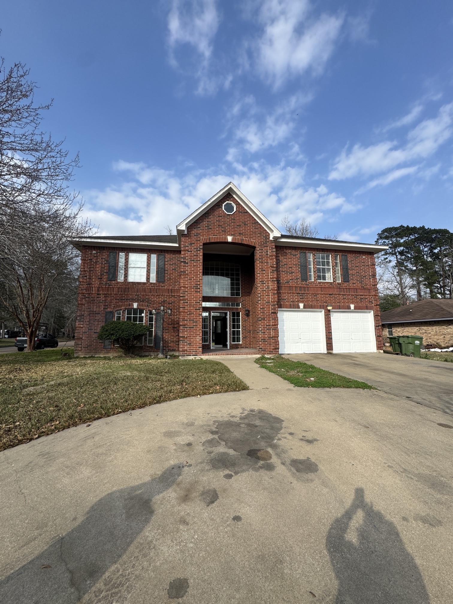 201 Pebble Springs Lane Cleveland, TX 77327 - Photo 2 of 27 a front view of a house with a yard and garage