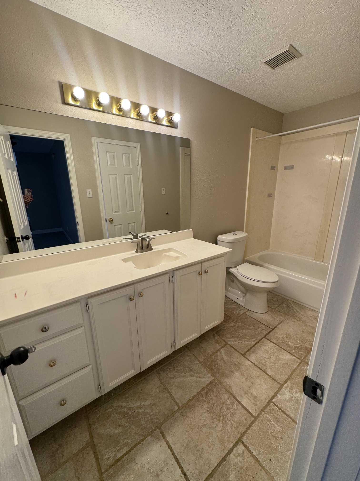201 Pebble Springs Lane Cleveland, TX 77327 - Photo 24 of 27 a spacious bathroom with a double vanity sink a toilet and a mirror