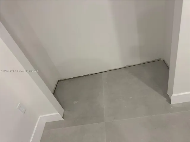 a stove top oven sitting inside of a kitchen