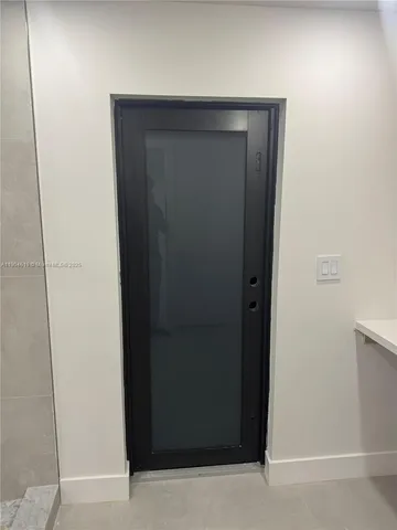 a close view of utility room with washer and dryer