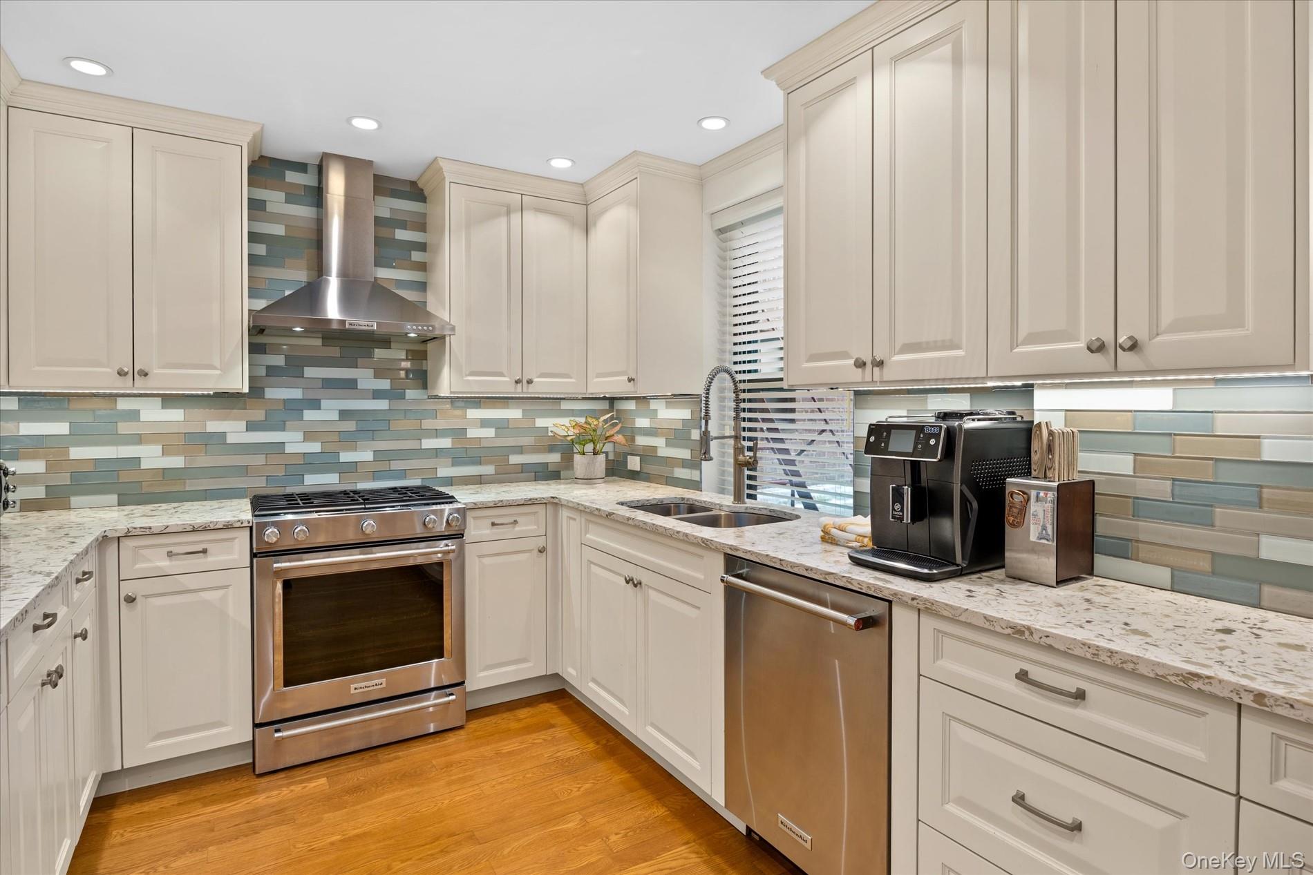 83-30 98th Street, Unit 1H Queens, NY 11421 - Photo 1 of 18 a kitchen with stainless steel appliances granite countertop a stove a sink and white cabinets