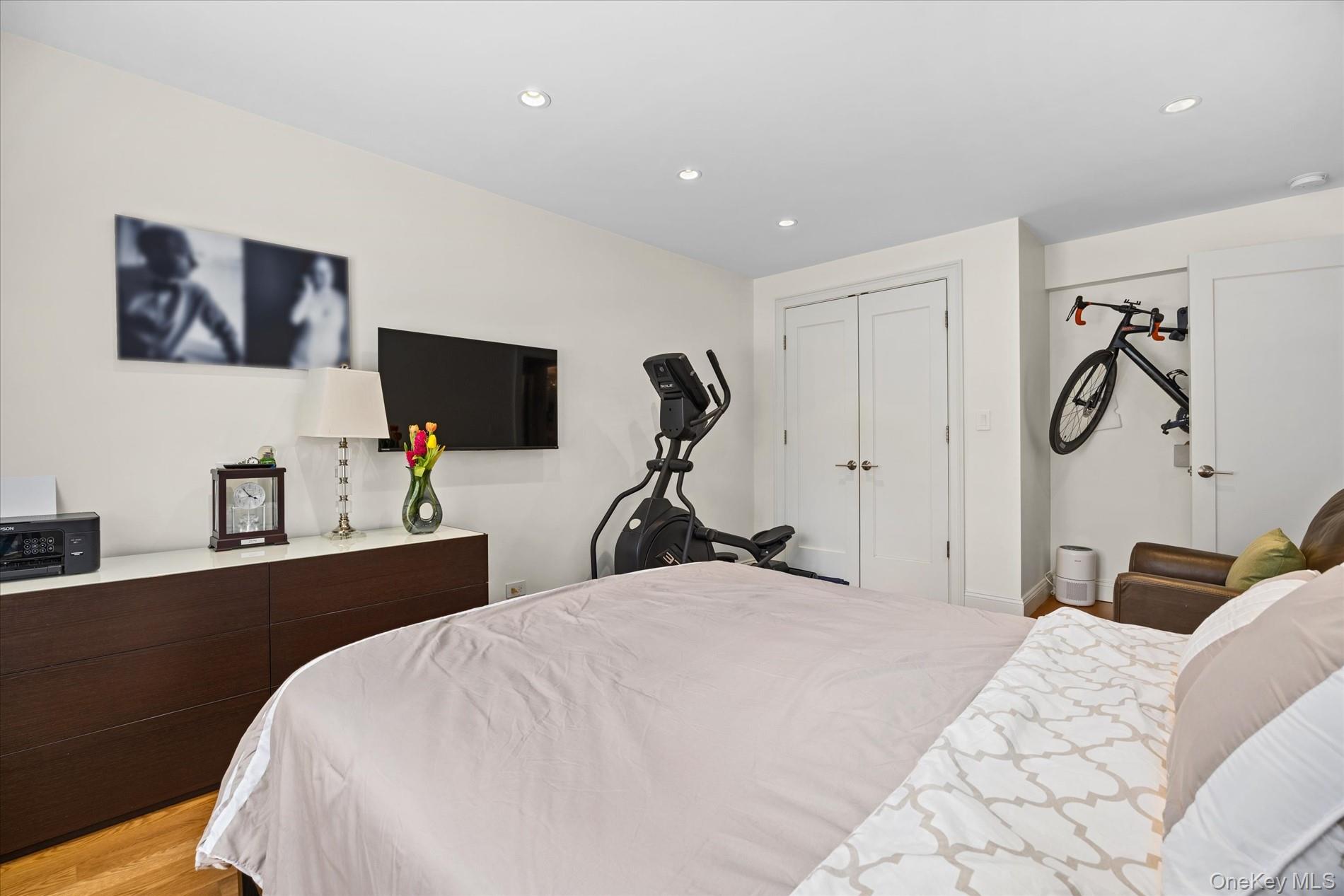 83-30 98th Street, Unit 1H Queens, NY 11421 - Photo 11 of 18 a bedroom with a bed and furniture