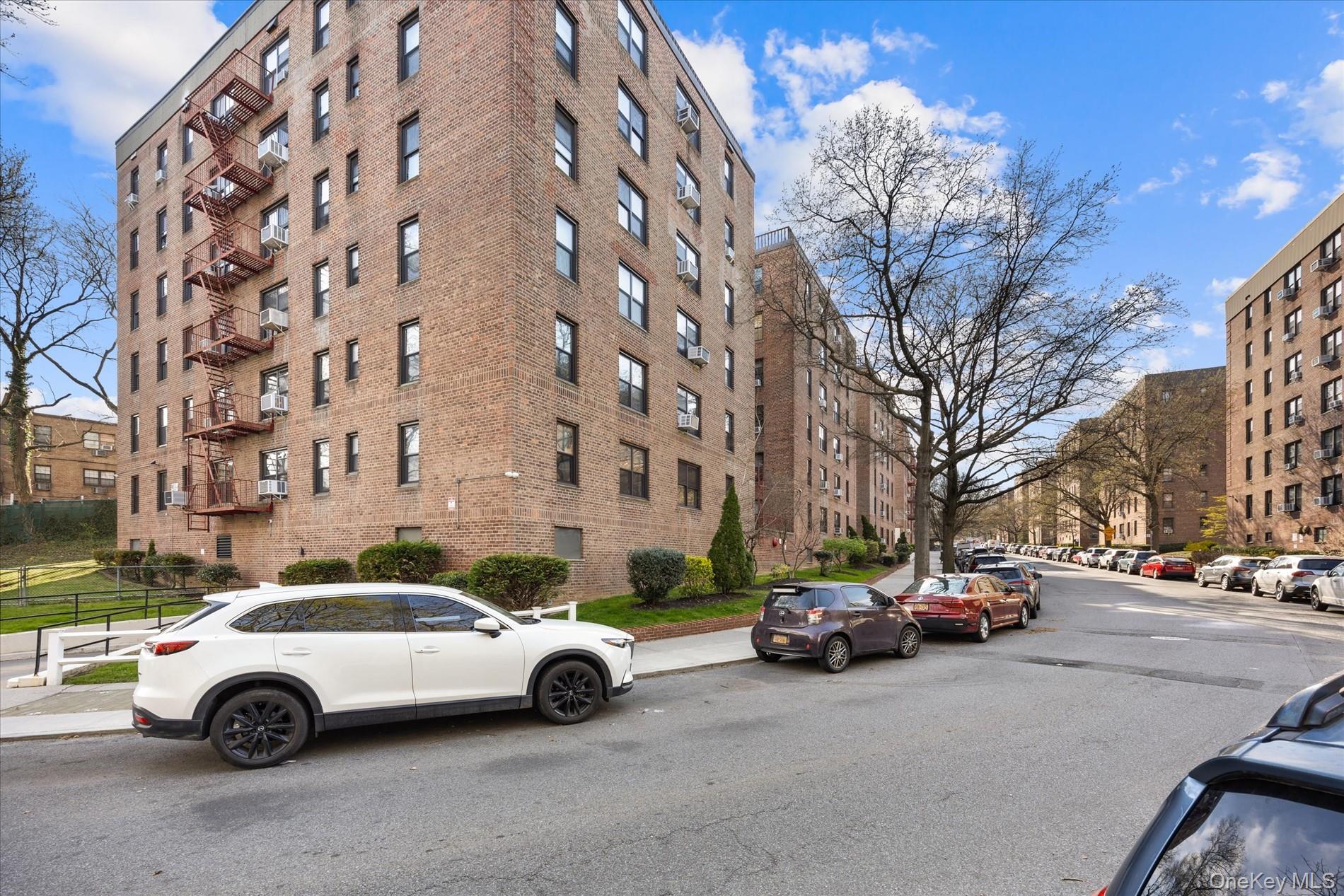 83-30 98th Street, Unit 1H Queens, NY 11421 - Photo 18 of 18 a car parked in front of a building