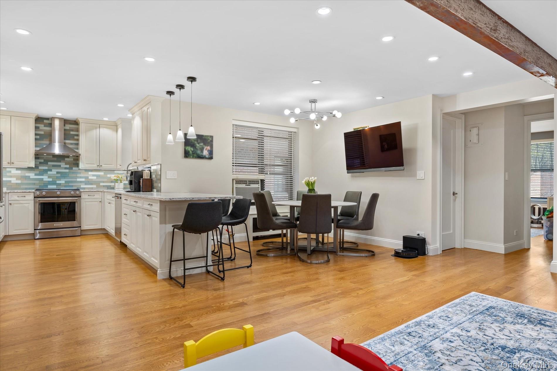 83-30 98th Street, Unit 1H Queens, NY 11421 - Photo 6 of 18 a living room with fireplace furniture and a flat screen tv