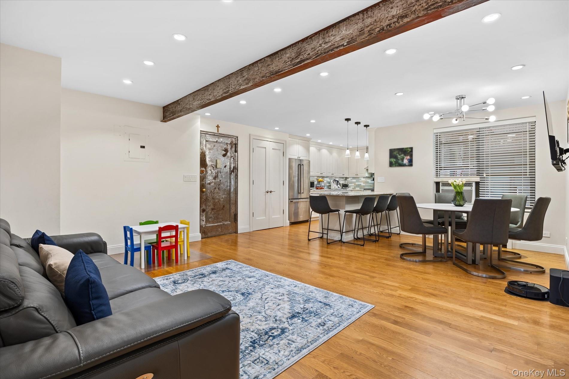 83-30 98th Street, Unit 1H Queens, NY 11421 - Photo 7 of 18 a living room with furniture and a table