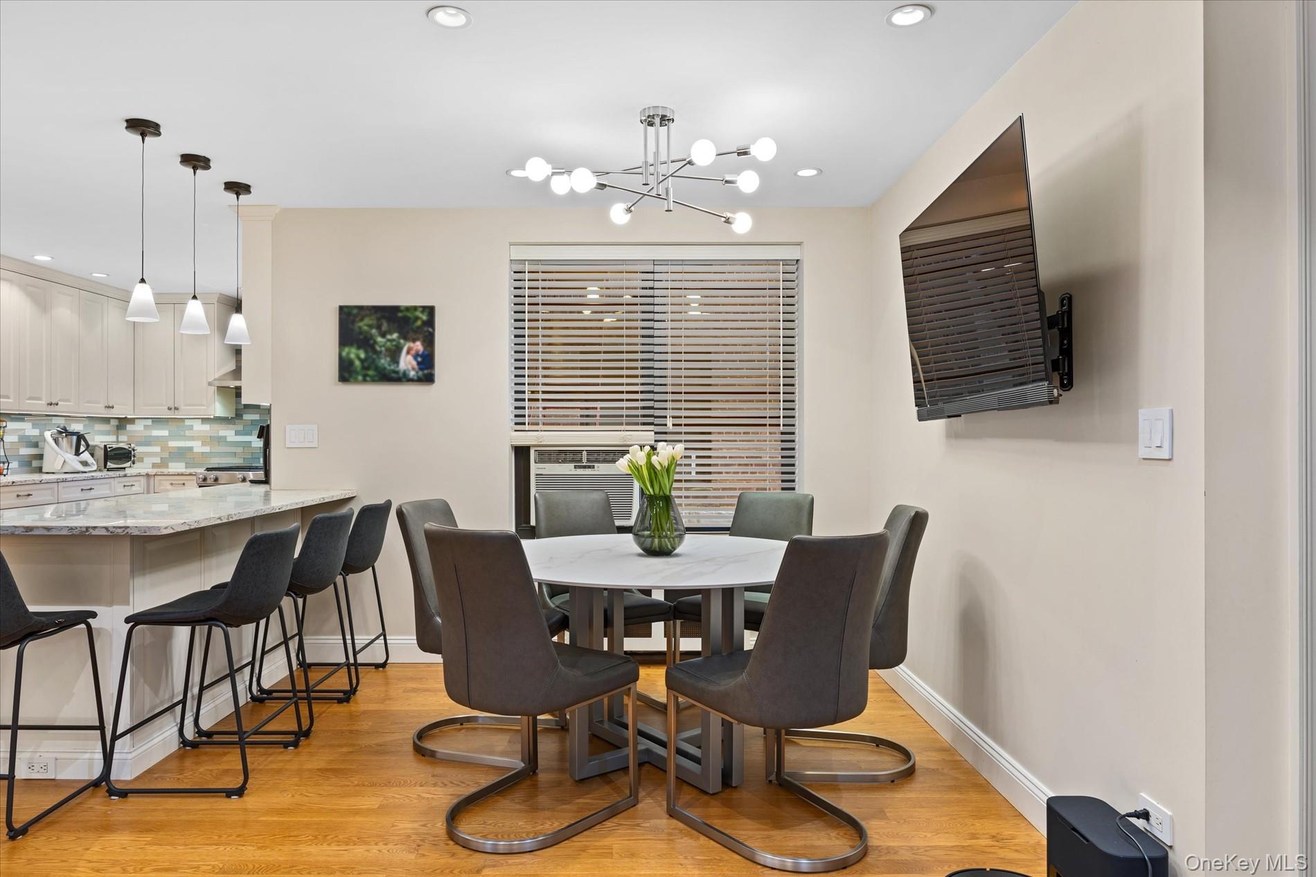 83-30 98th Street, Unit 1H Queens, NY 11421 - Photo 8 of 18 a view of a dining room with furniture window and wooden floor
