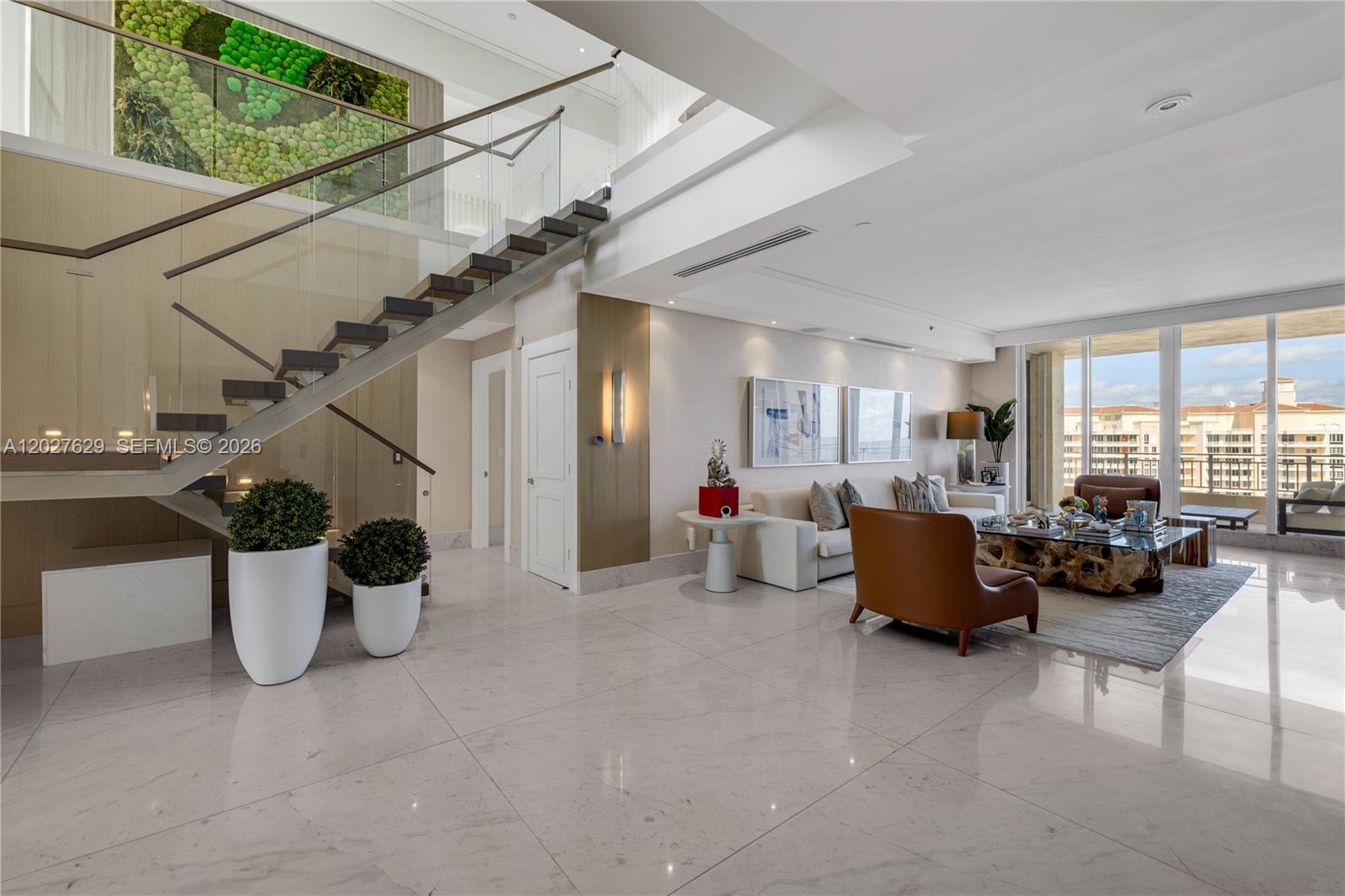799 Crandon Boulevard, Unit PH8 Key Biscayne, FL 33149 - Photo 5 of 47 a view of a living room and dining room