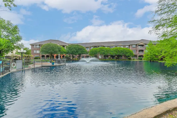 a view of a lake with a building in the background