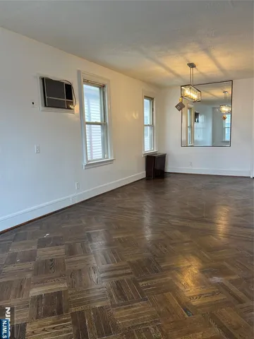 a view of an empty room with glass door