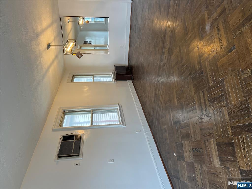 34 Garretson Avenue, Unit 2 Bayonne, NJ 07002 - Photo 6 of 12 a view of an empty room with glass door