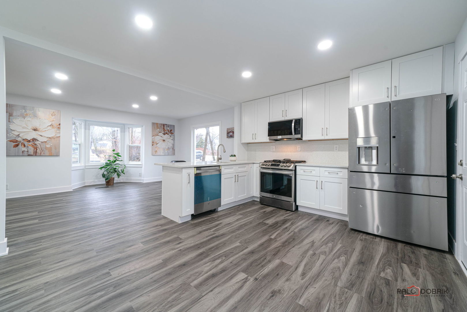 38236 North Lee Avenue Spring Grove, IL 60081 - Photo 11 of 25 a kitchen with a refrigerator and a stove top oven