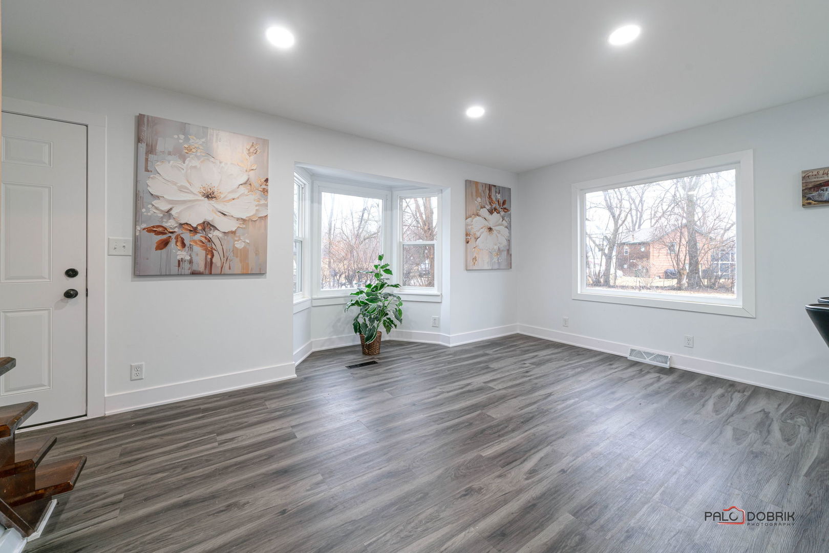 38236 North Lee Avenue Spring Grove, IL 60081 - Photo 4 of 25 an empty room with wooden floor and windows